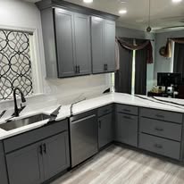 Gray shaker cabinets and quartz countertops kitchen renovation